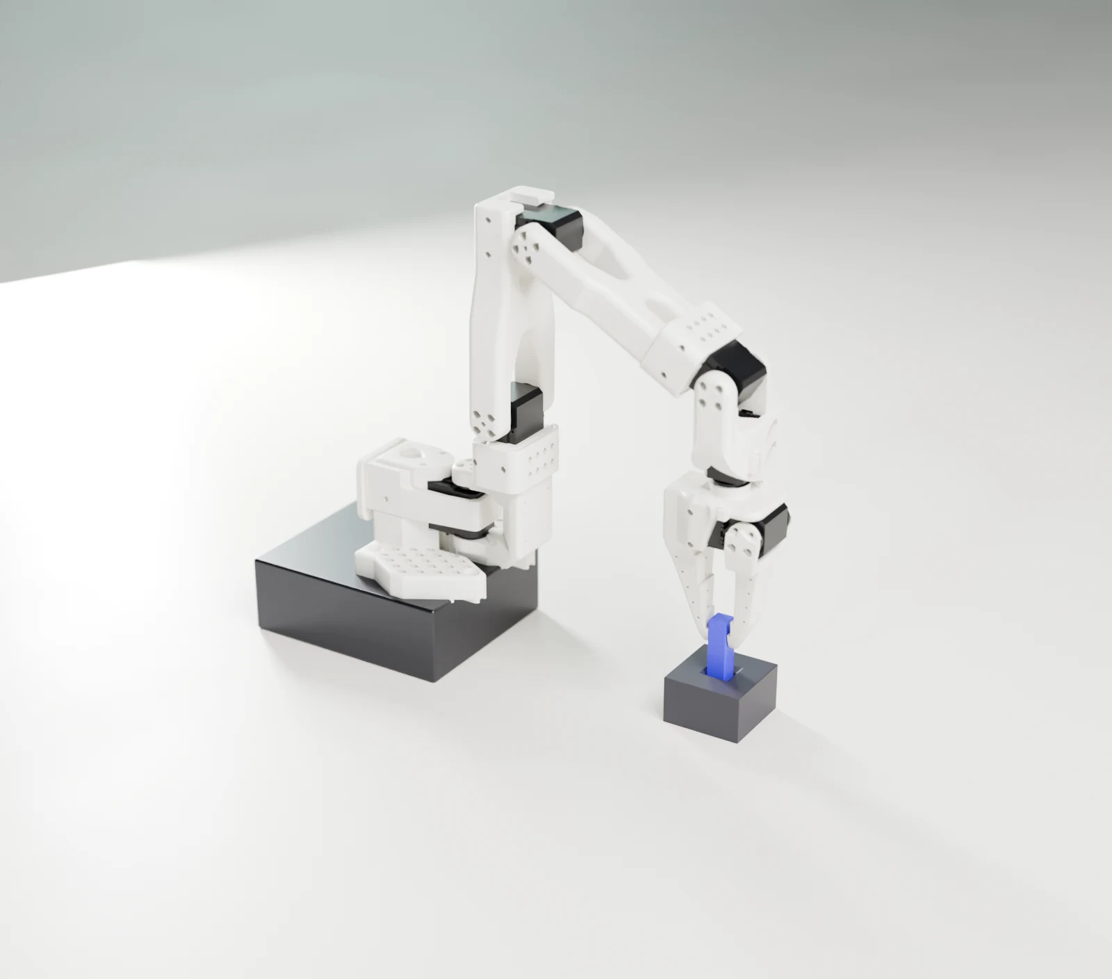 A desktop robot arm whose gripper holds a violet peg seated in a dark fixture, on paper